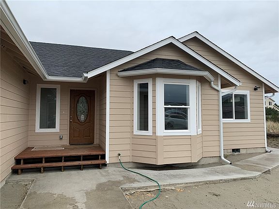 Front entrance, porch and wrap around sidewalk