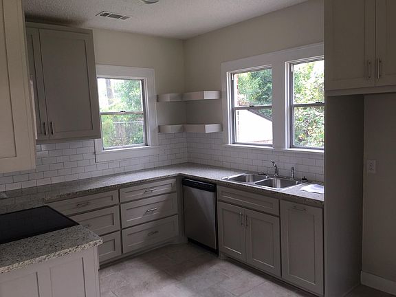 Recently updated kitchen with stove, vent hood and dishwasher