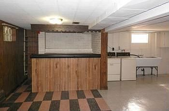 Finished basement with rec room & bar plus a 3 piece bath
