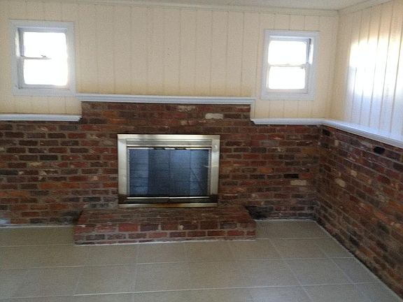 Den w/wood burning fireplace
