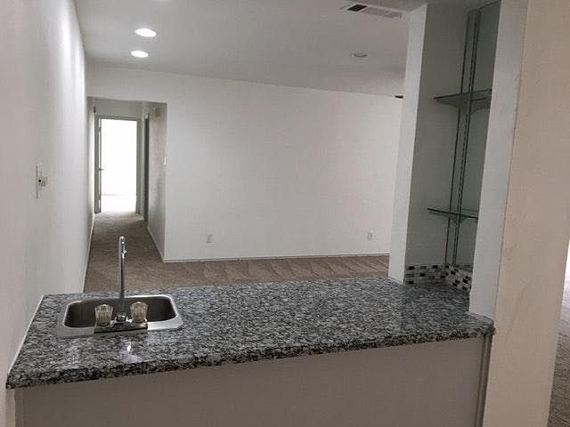 Bar separating dining area from living area