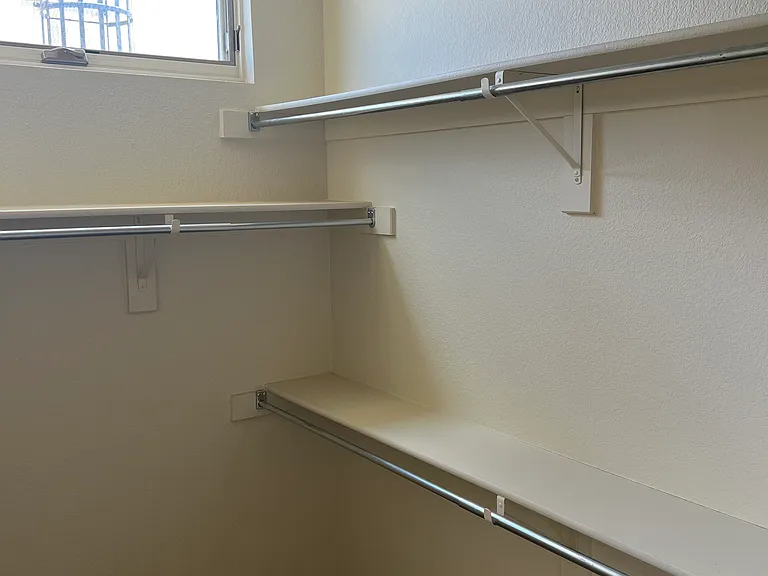 Large primary bedroom walk in closet