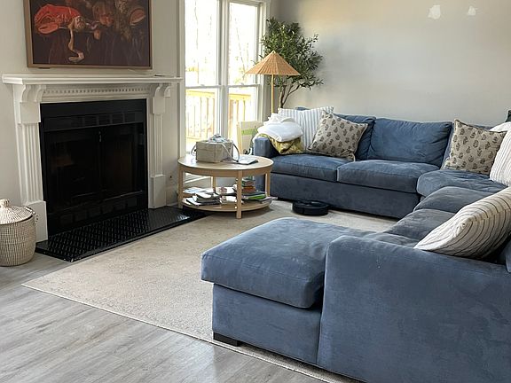 View of stunning living Room Area retrofitted with a Fireplace to keep you warm during Winter Months __