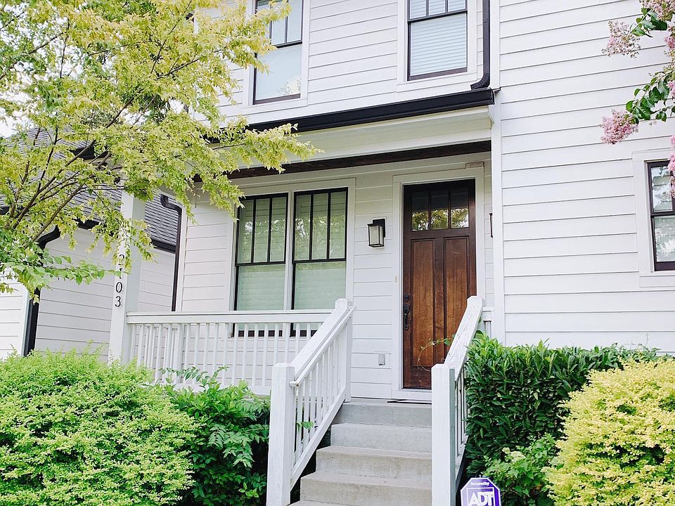 Front entrance of the house and a 2-car garage.