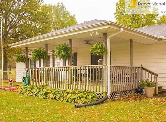 Comfortable covered deck overlooks your land to the north.