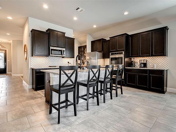 18x17 Kitchen - An open Kitchen area is inviting for the cook and the guests. Preparing food can be fun for all. Bar seating is also great for helping kids with homework while preparing a meal.