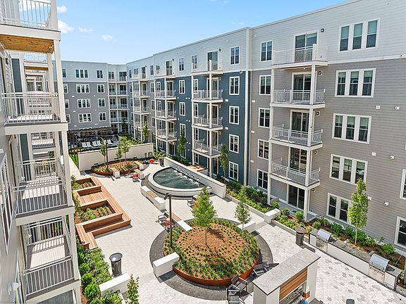 Expansive courtyards with grilling stations and lounge areas