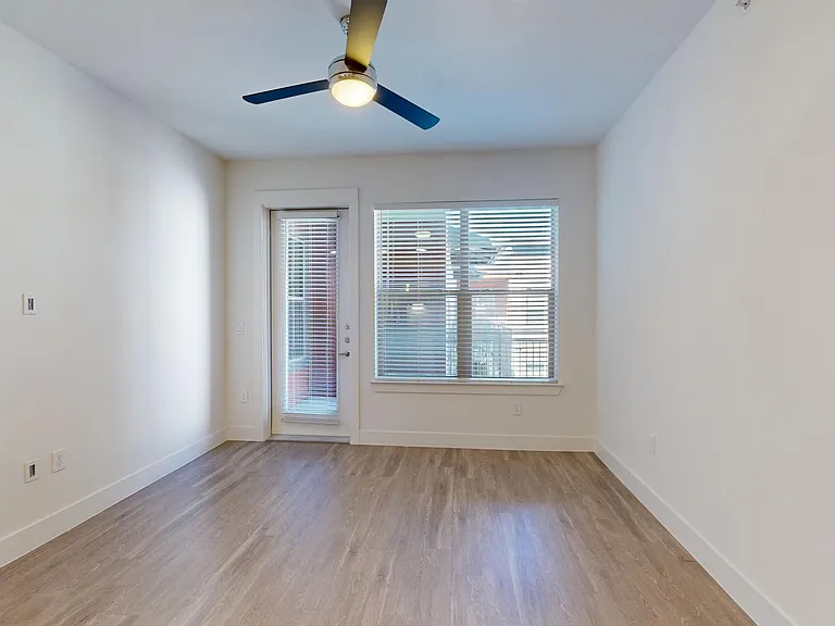 Apartment living room with wood-style flooring.
