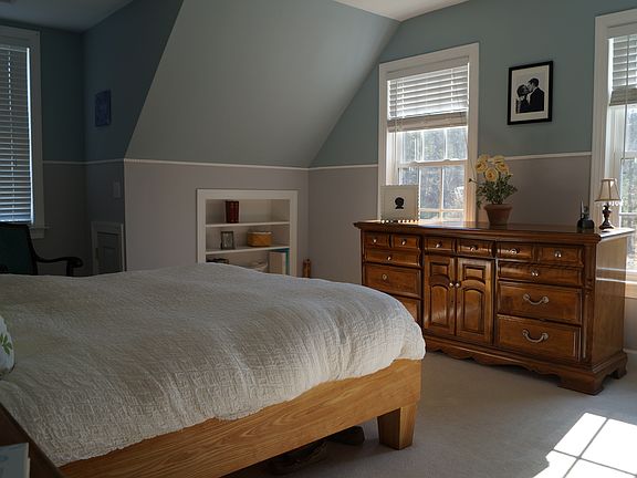 Bedroom has wall bookcase