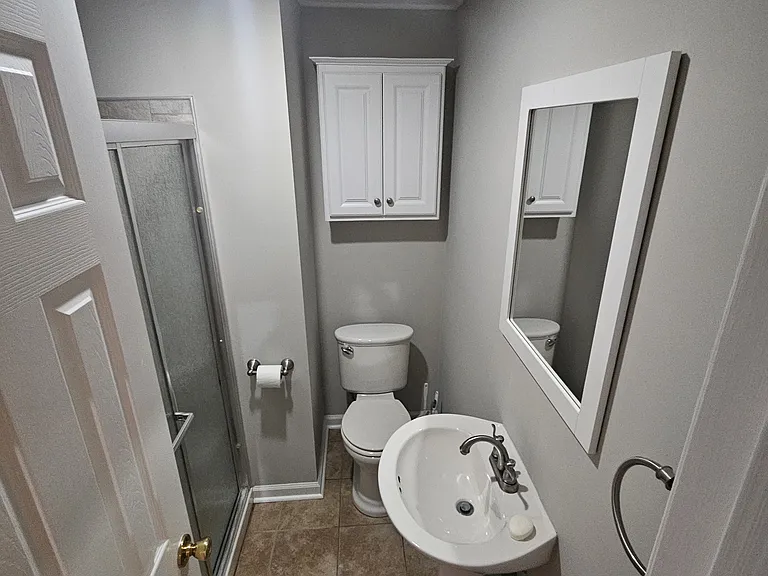 Full bath with tile floors, new paint and tile shower.