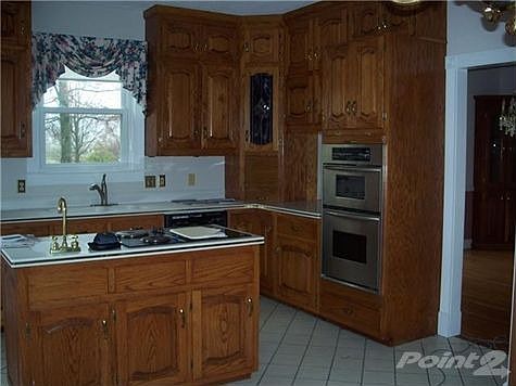 Kitchen with Island & Corian Countertops