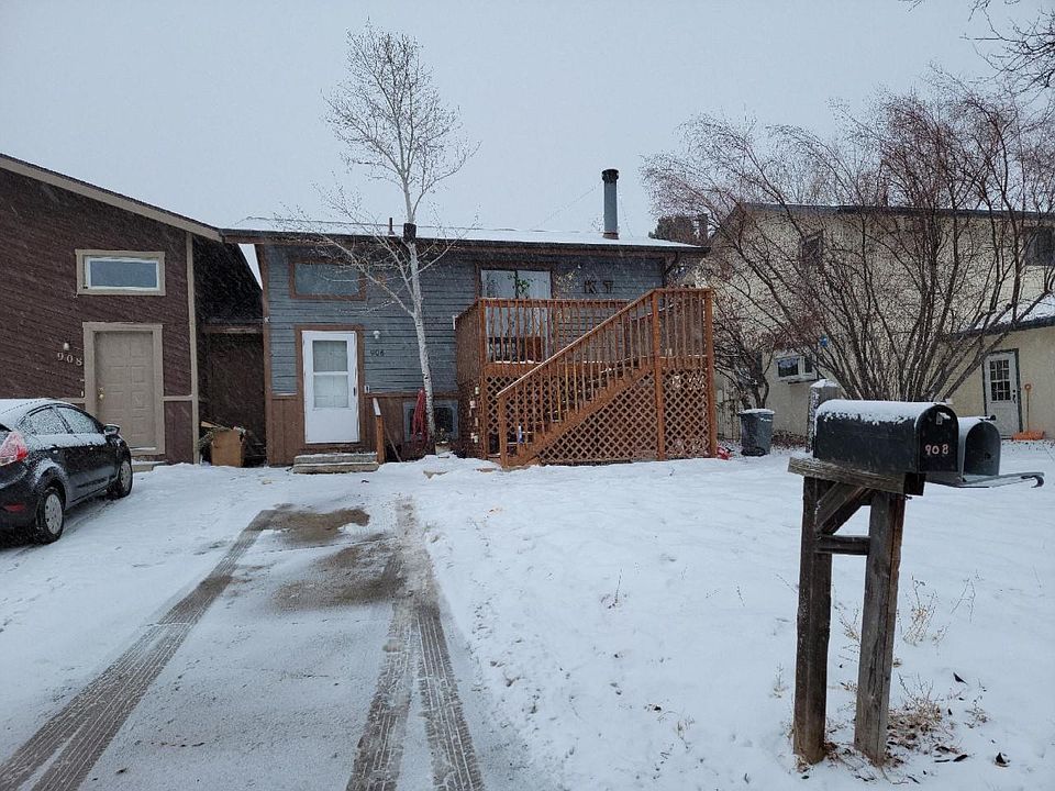 Front of unit with parking space