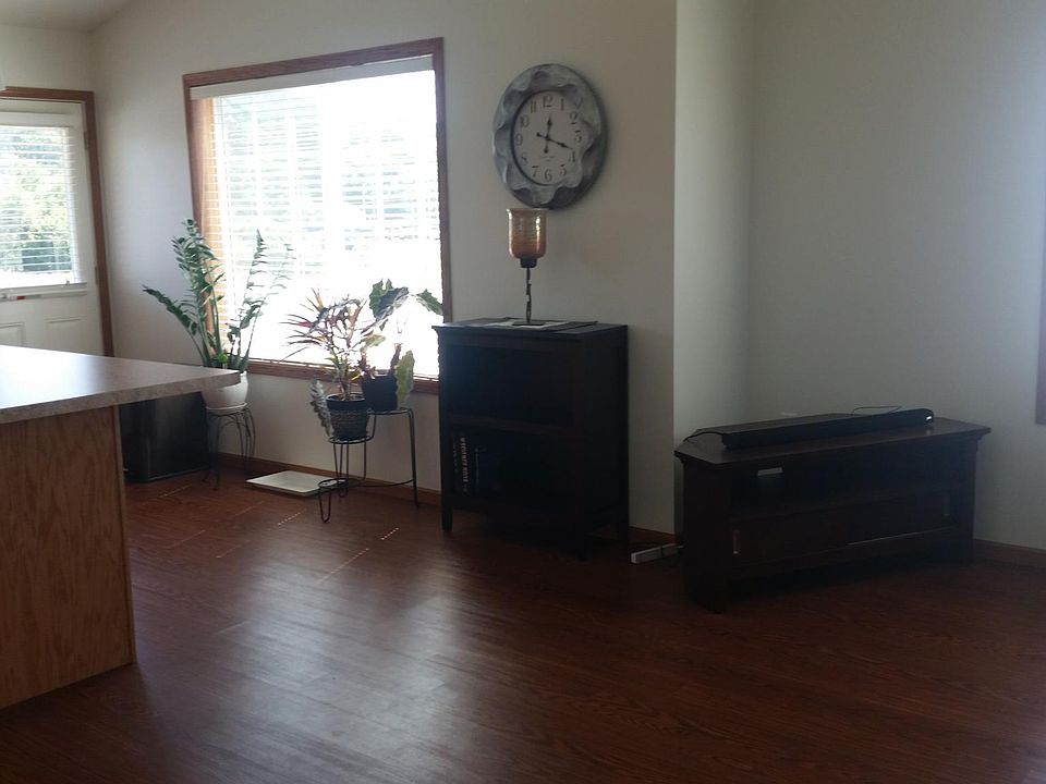 Kitchen area with island.Door leads to decj