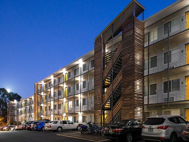 Enjoy Modern Living at Legacy Student Living with Well-Lit Parking and Stylish Architecture