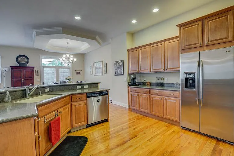 Luxury kitchen with premium finishes, extensive counter space, and walk-in pantry