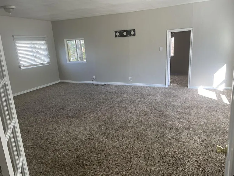 Back family room off of kitchen or huge bedroom