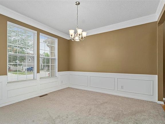 Formal dining room with new carpet, new paint and lot's of natural light