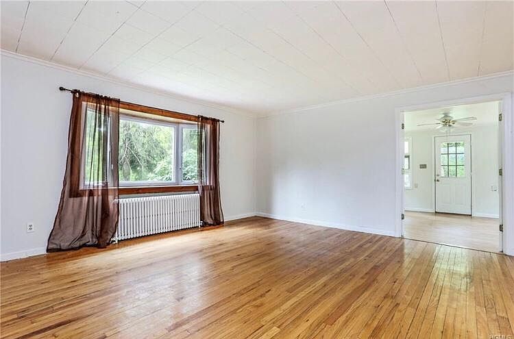 living room (unfurnished) view of 3rd bedroom