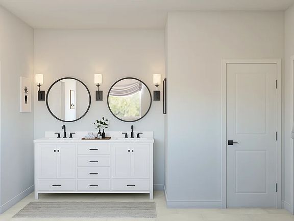Primary bath with freestanding vanity and matte black fixtures