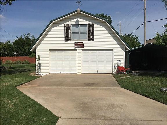 Concrete all the way to the shop.  Two stories with central heat and air.