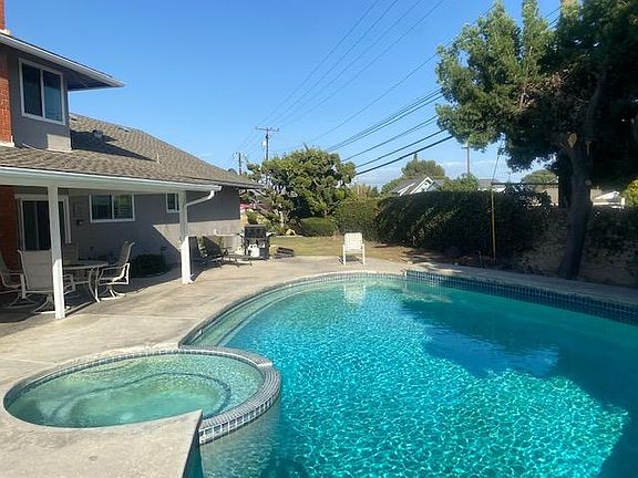 pool and jacuzzi covered patio