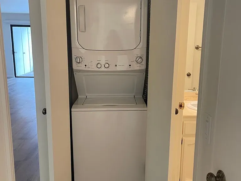 Laundry with stacked washer and dryer