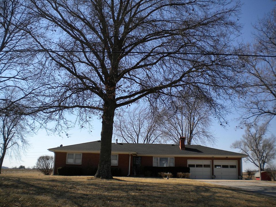 This full brick home is in a beautiful country setting with 