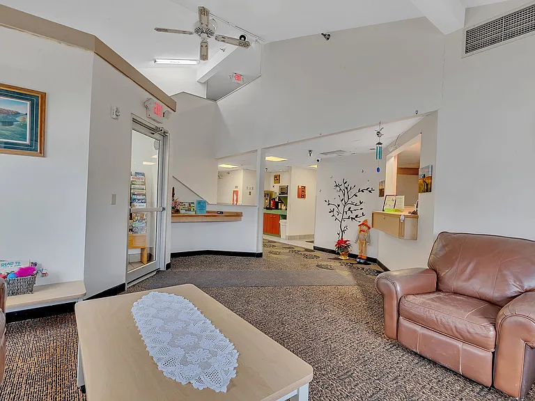 Relaxing common area with seating and natural light.
