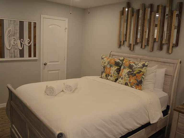 Bedroom 1 - a queen bed, smart tv and attached to bathroom 2.