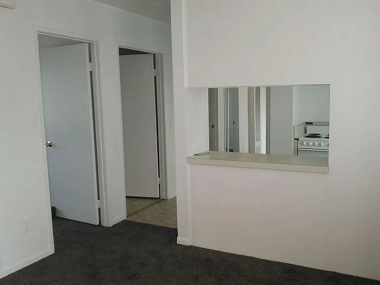 Front room looking towards open kitchen at Dubuque Apartments.
