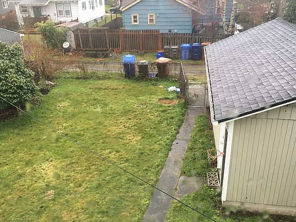 View of garage & fenced back