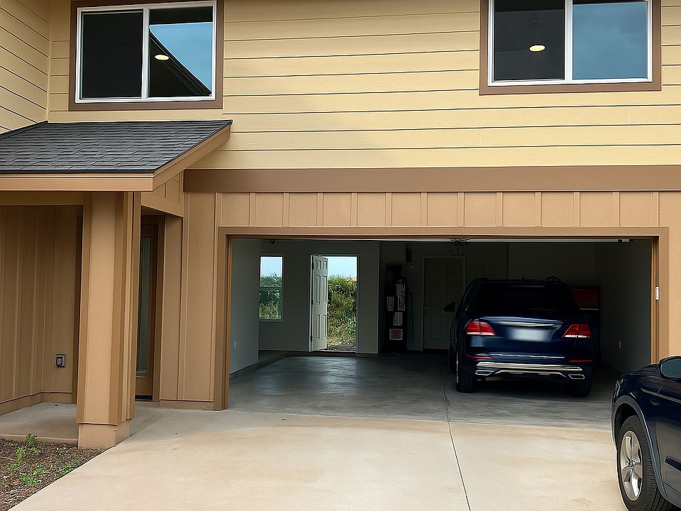 Over-sized 2 car garage with door access to the fenced-in backyard and to the main house. Full sized washer, dryer, and water heater also are also housed here.