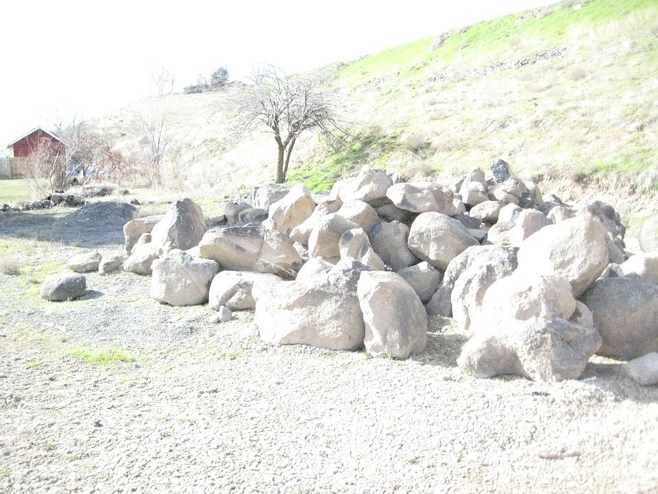 Boulders for retaining wall