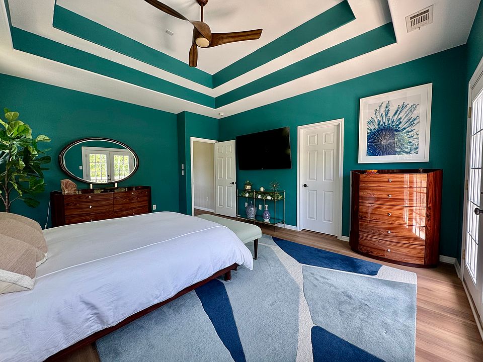 Primary bedroom leads to the primary bathroom and walk-in closet
