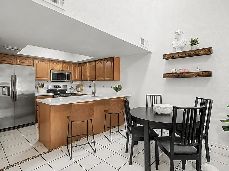 Kitchen and dining room. Add the leaf to seat 6 at the dining table.
(Comfortably seats 8 in this space!)