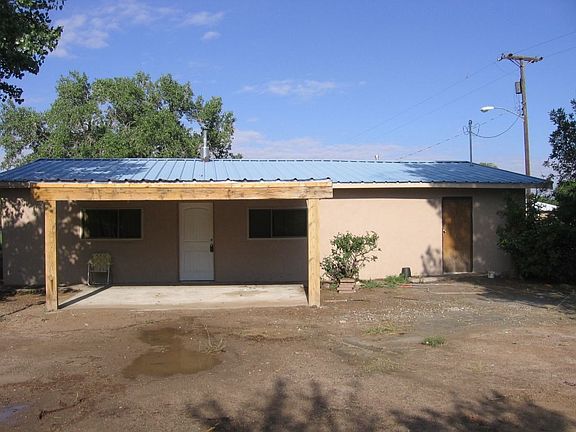 View of the home facing West shows the new Covered Patio