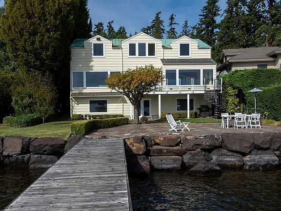 Private deep-water dock with 7,000-lb boat lift_ready for boating, paddleboarding, and sunset cruises.