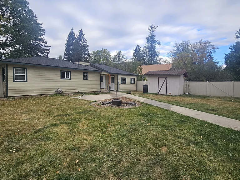 Yard with patio and outdoor fire pit