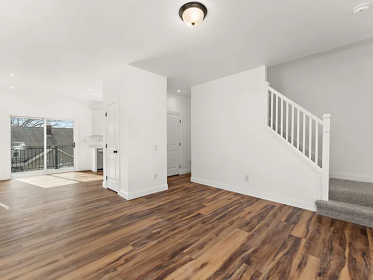 Living Room view into Dining Area through slider onto Back Deck
