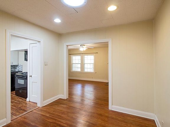 dining room looking to living room, sky light in dining room