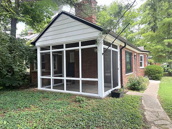 Relax on the screened porch, overlooking the partially shaded front yard.