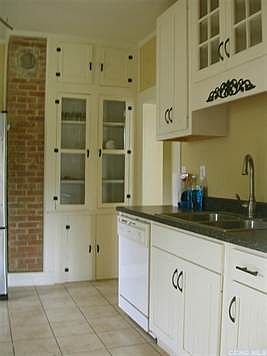 Kitchen-  with many cupboards.