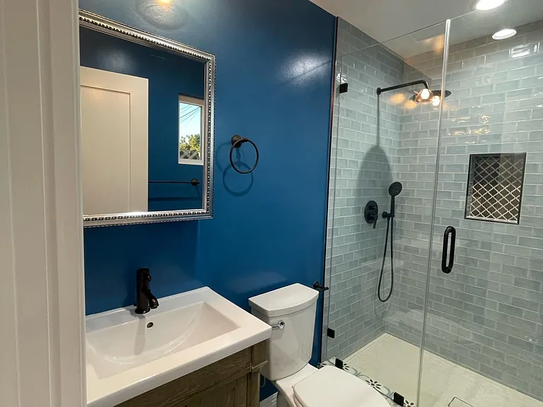 Medicine cabinet, plenty of light with recessed lighting and over sink light fixture.