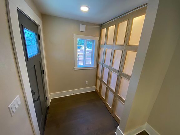 Entrance to the left and storage to the right.