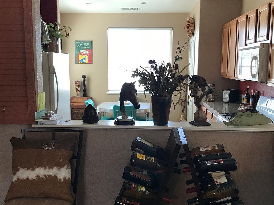 Looking into kitchen from living room (furnishings not inclu