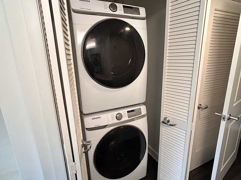 Full Size SamSung Washer & Dryer is located in the bath room.