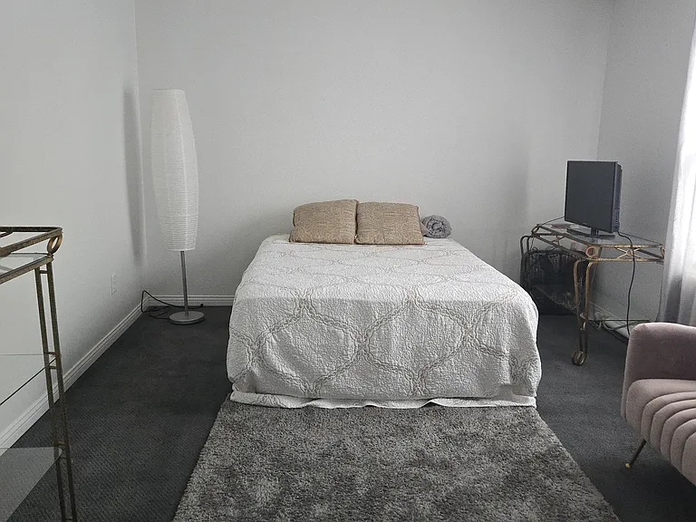 Bedroom 3: Queen bed, dresser, walk-in closet, area rug, remote-controlled ceiling fan, curtains, chair