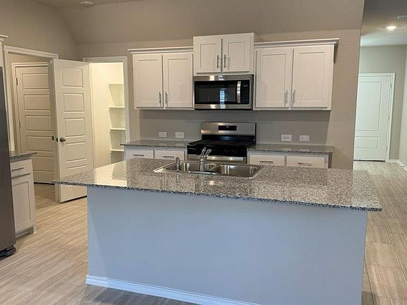 Kitchen- All Home and community information, including pricing, included features, terms, availability and amenities, are subject to change at any time without notice or obligation. All Drawings, pictures, photographs, video, square footages, floor plans, elevations, features, colors and sizes are approximate for illustration purposes only and will vary from the homes as built.