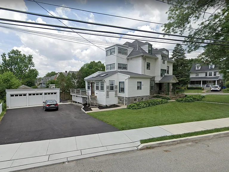 Apartment included garage (far right) and exclusive parking spot in front of it