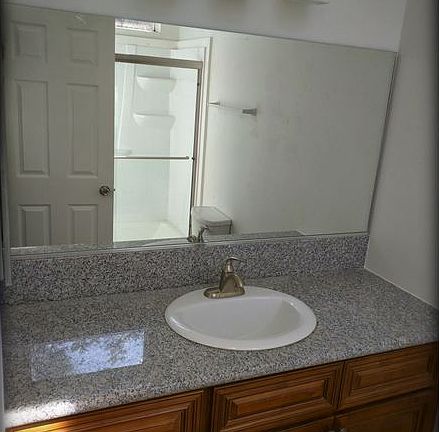 Master Bedroom Bathroom: Updated interior with granite count